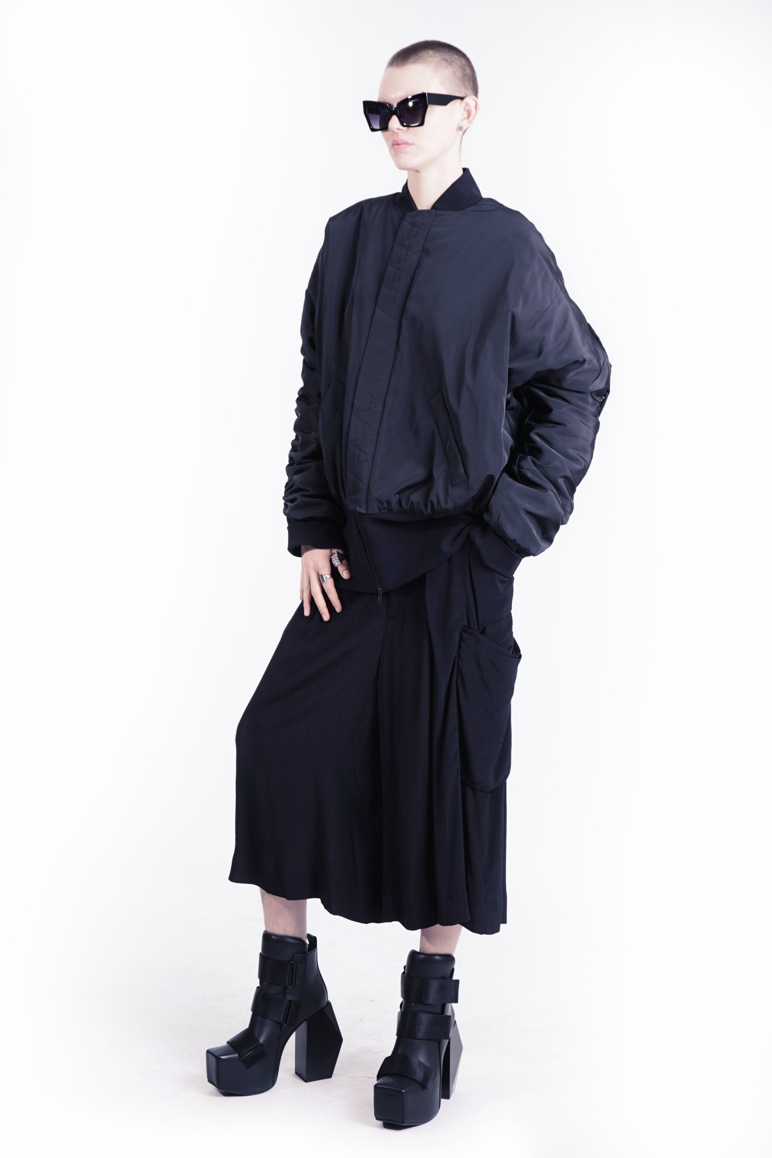 Front view of oversized padded bomber jacket in black