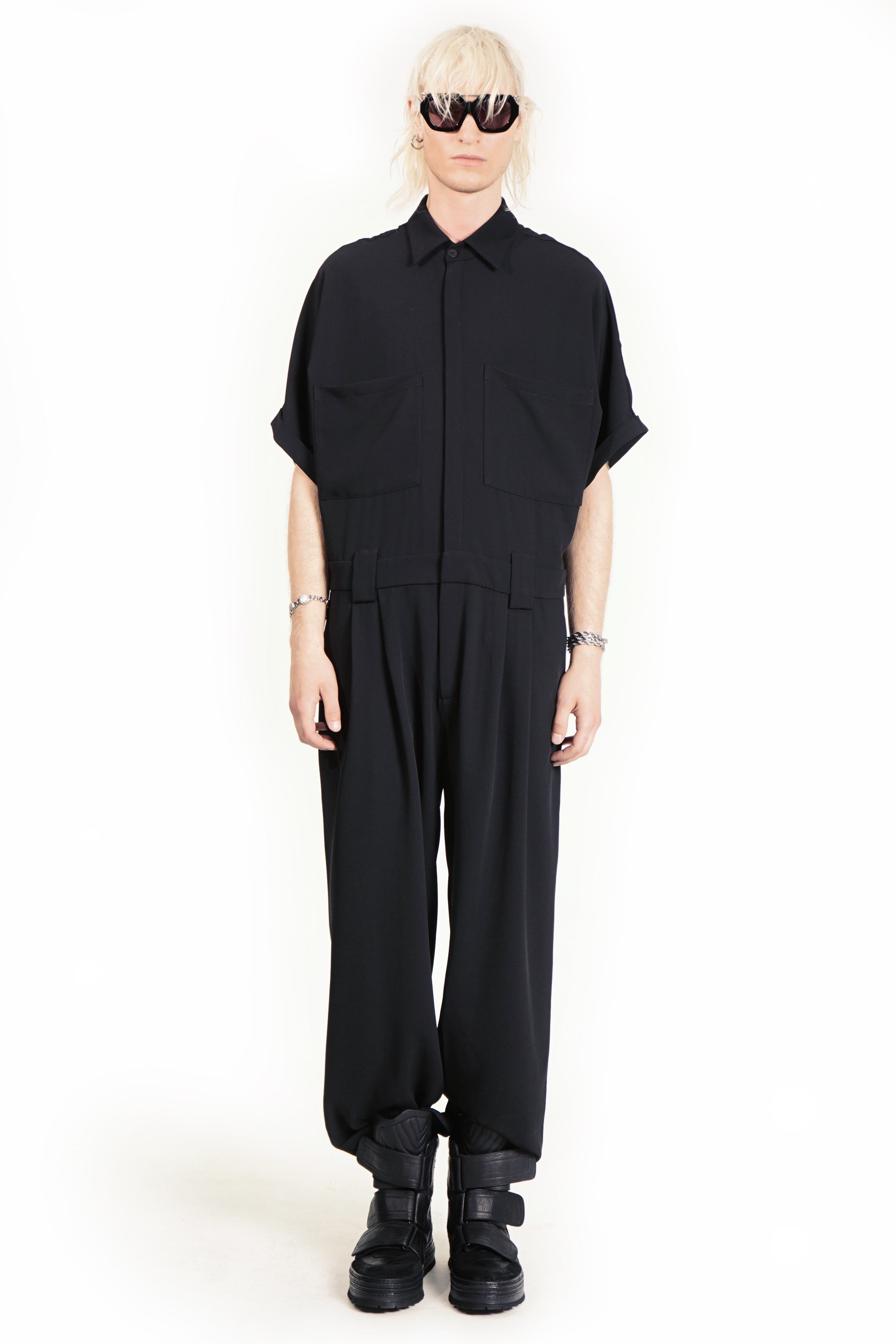 Front view of tailored jumpsuit with dropped shoulders