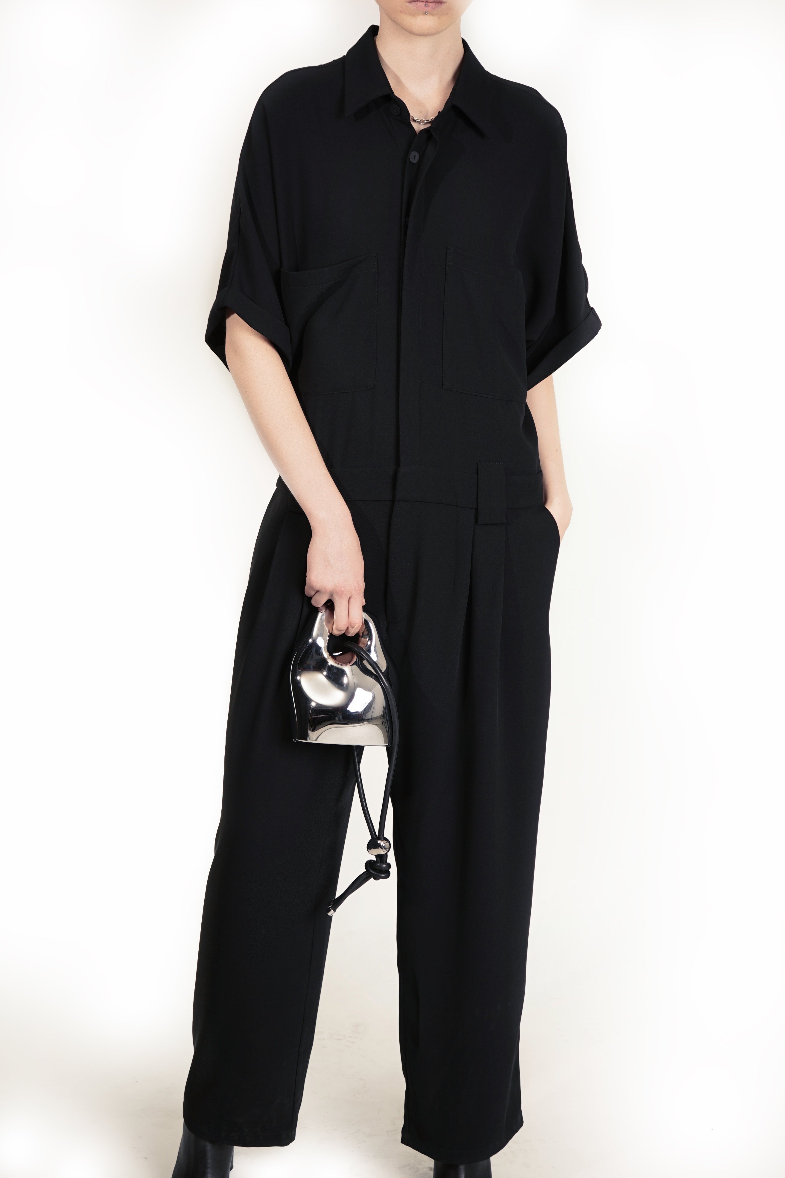 One-piece jumpsuit with breast pockets and waist pleats