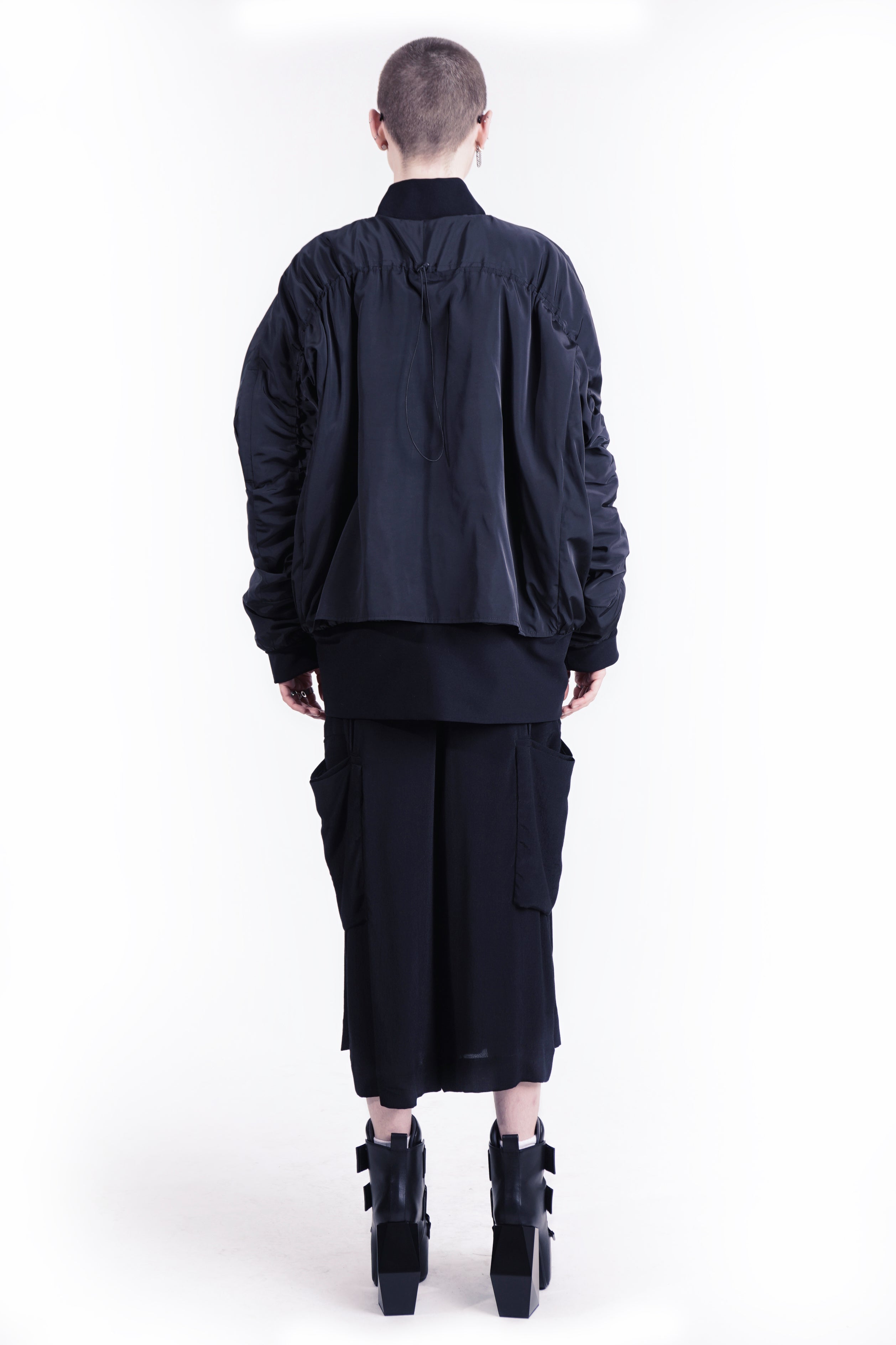 Back detail of gathered oversized bomber jacket