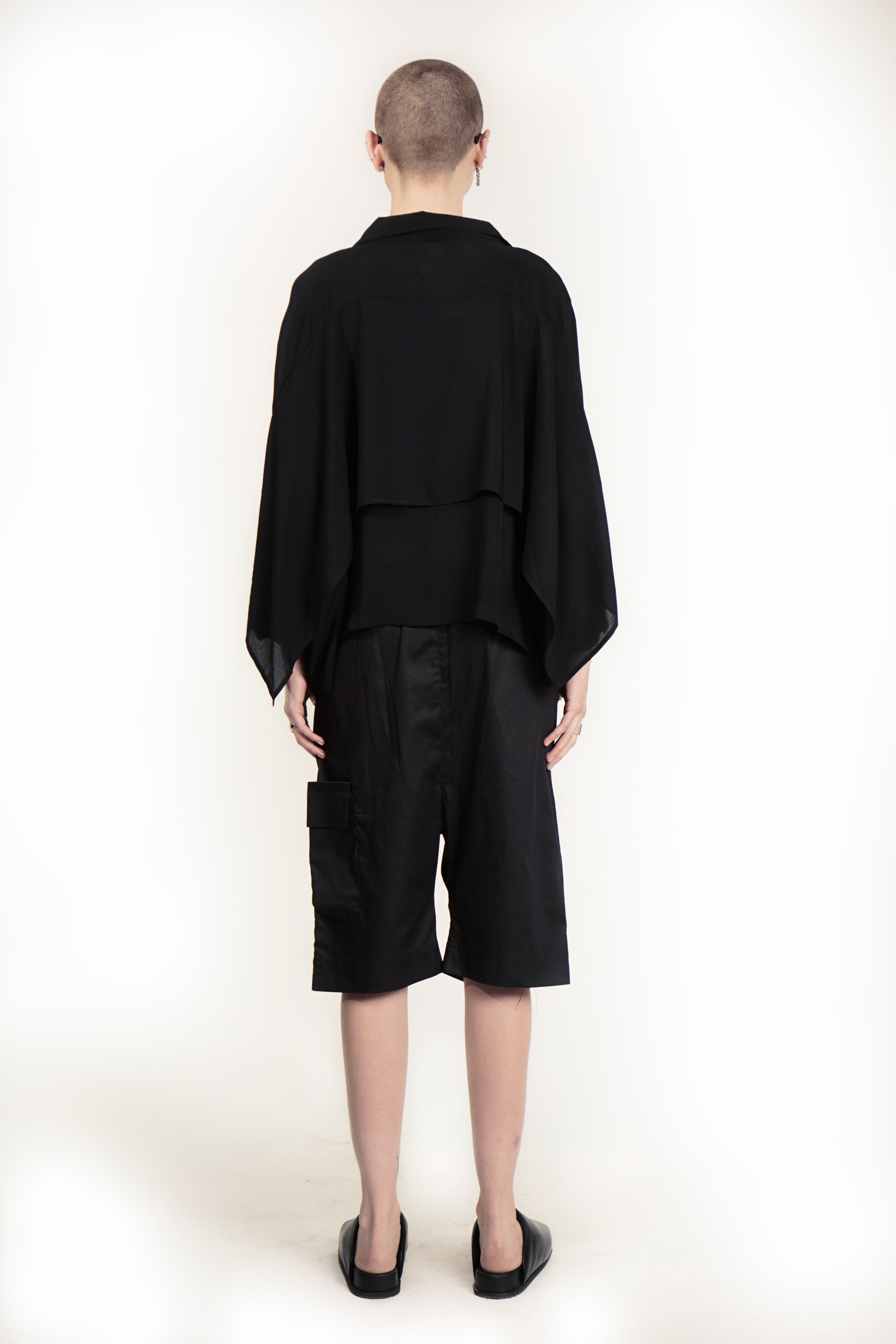Contemporary black blouse with soft drape