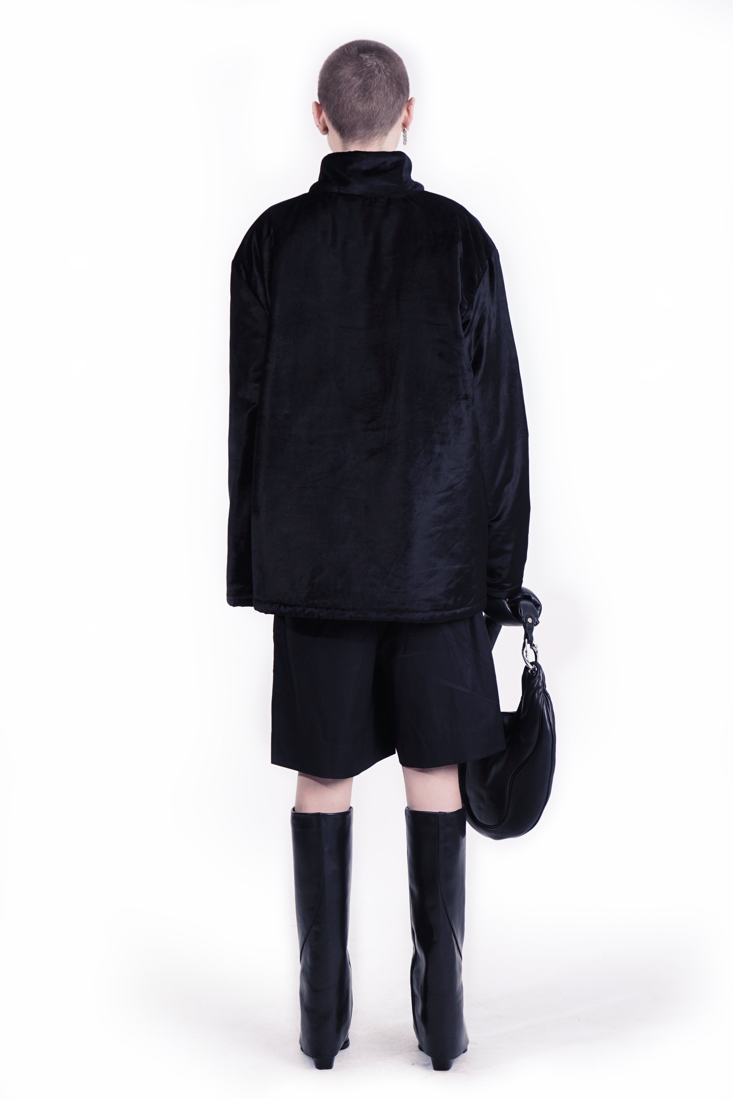Back View Black velvet jacket with minimal zip-front construction