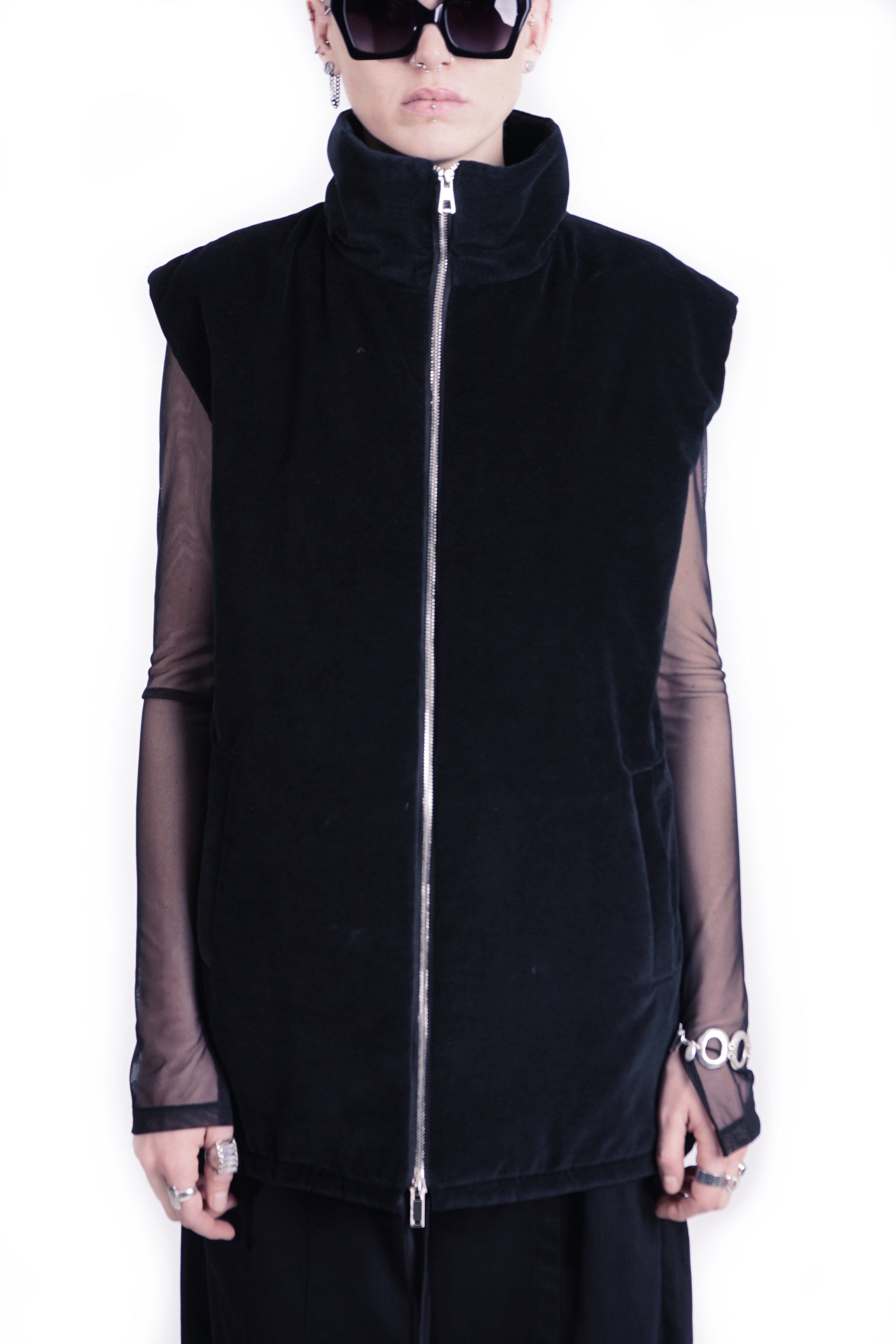 Front view of oversized black outerwear vest woth stand collar 