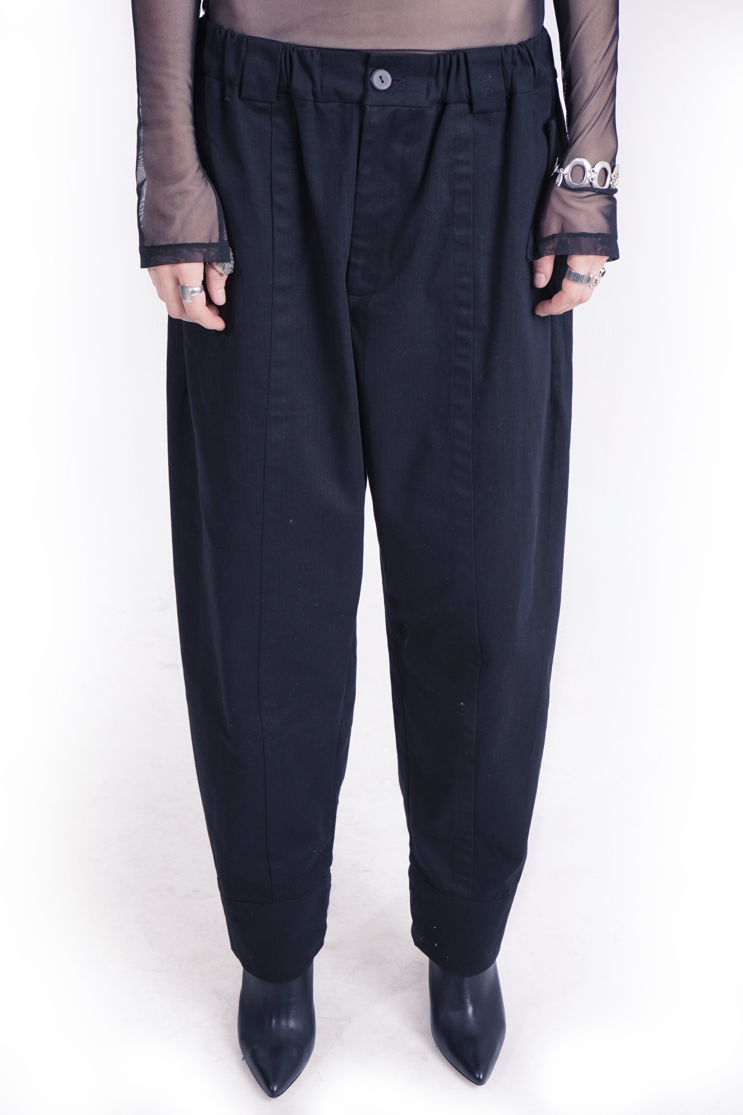 Black cotton trousers with elastic waistband and zip closure