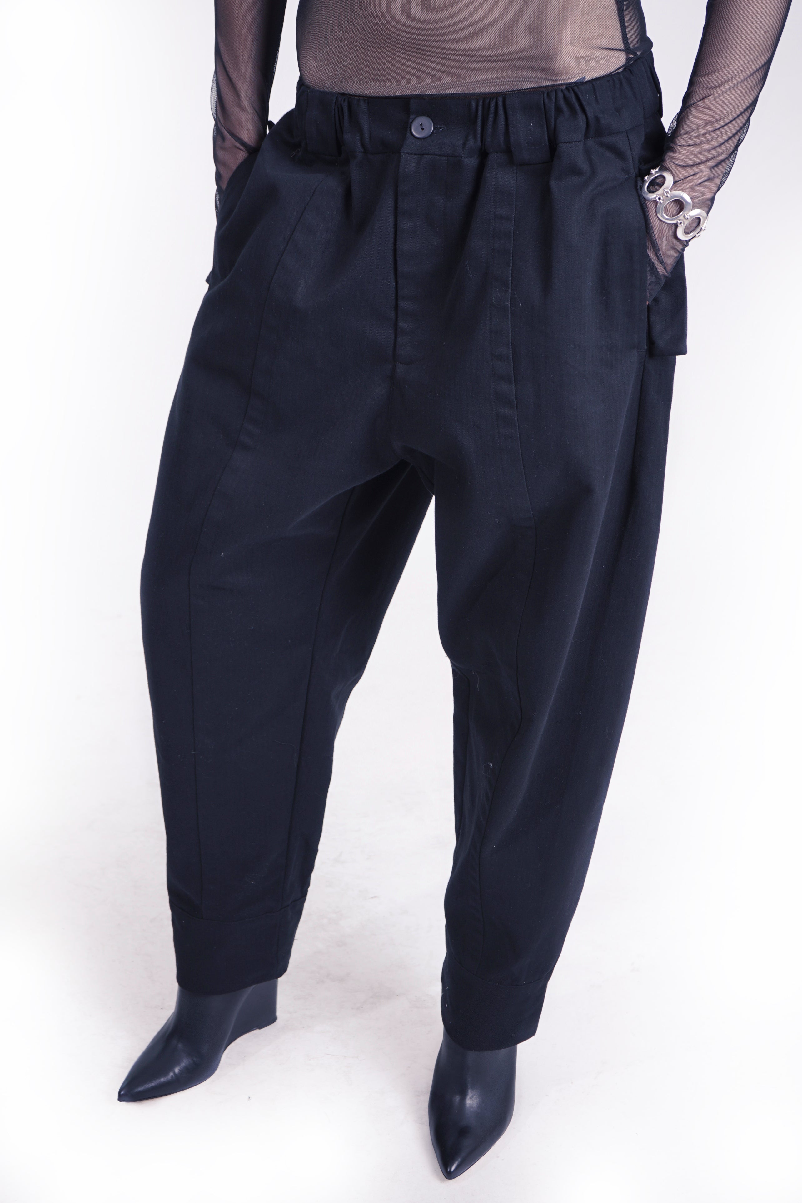 Minimal cotton barrel pants styled with oversized outerwear