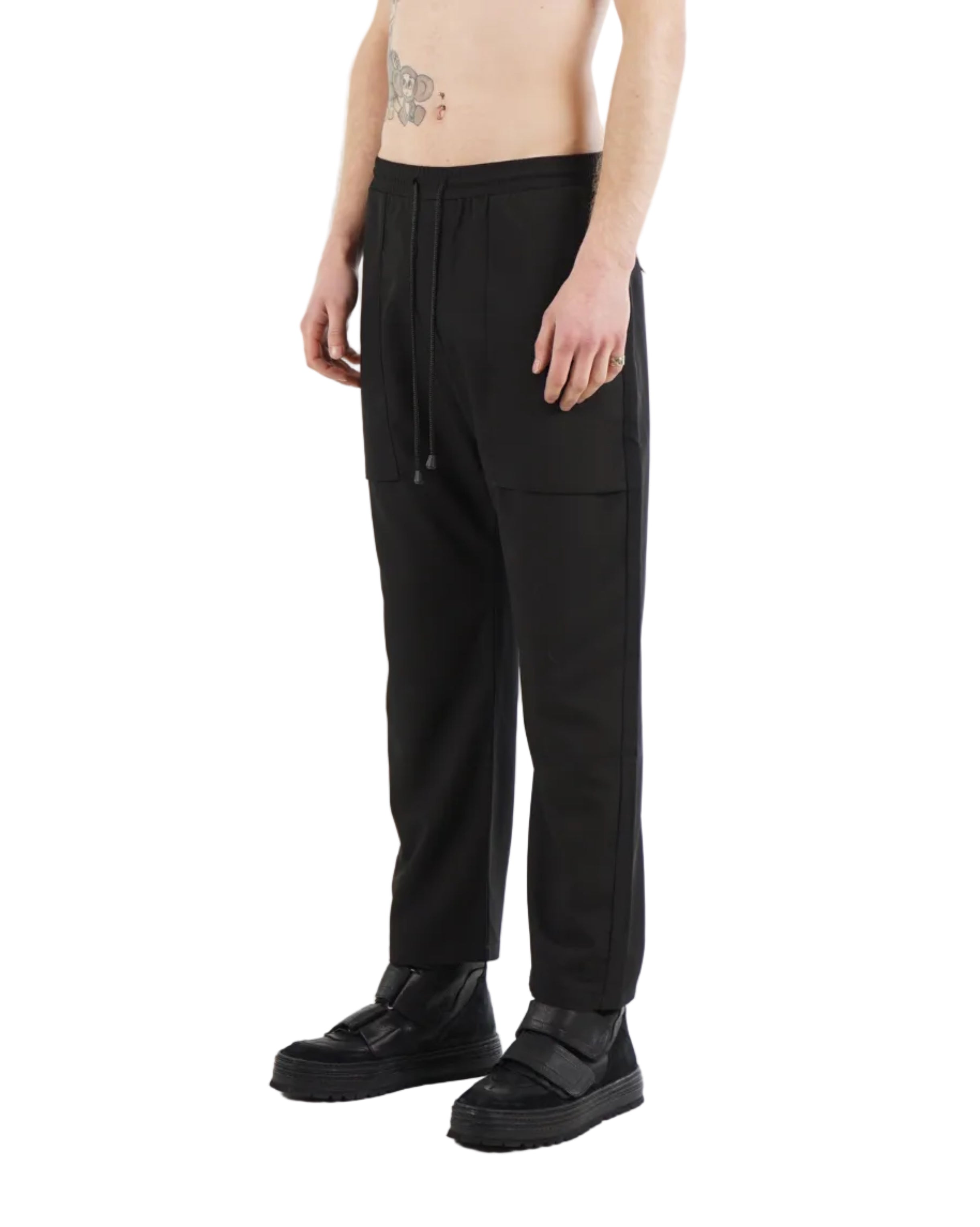 Back view of tapered trousers with zip pockets
