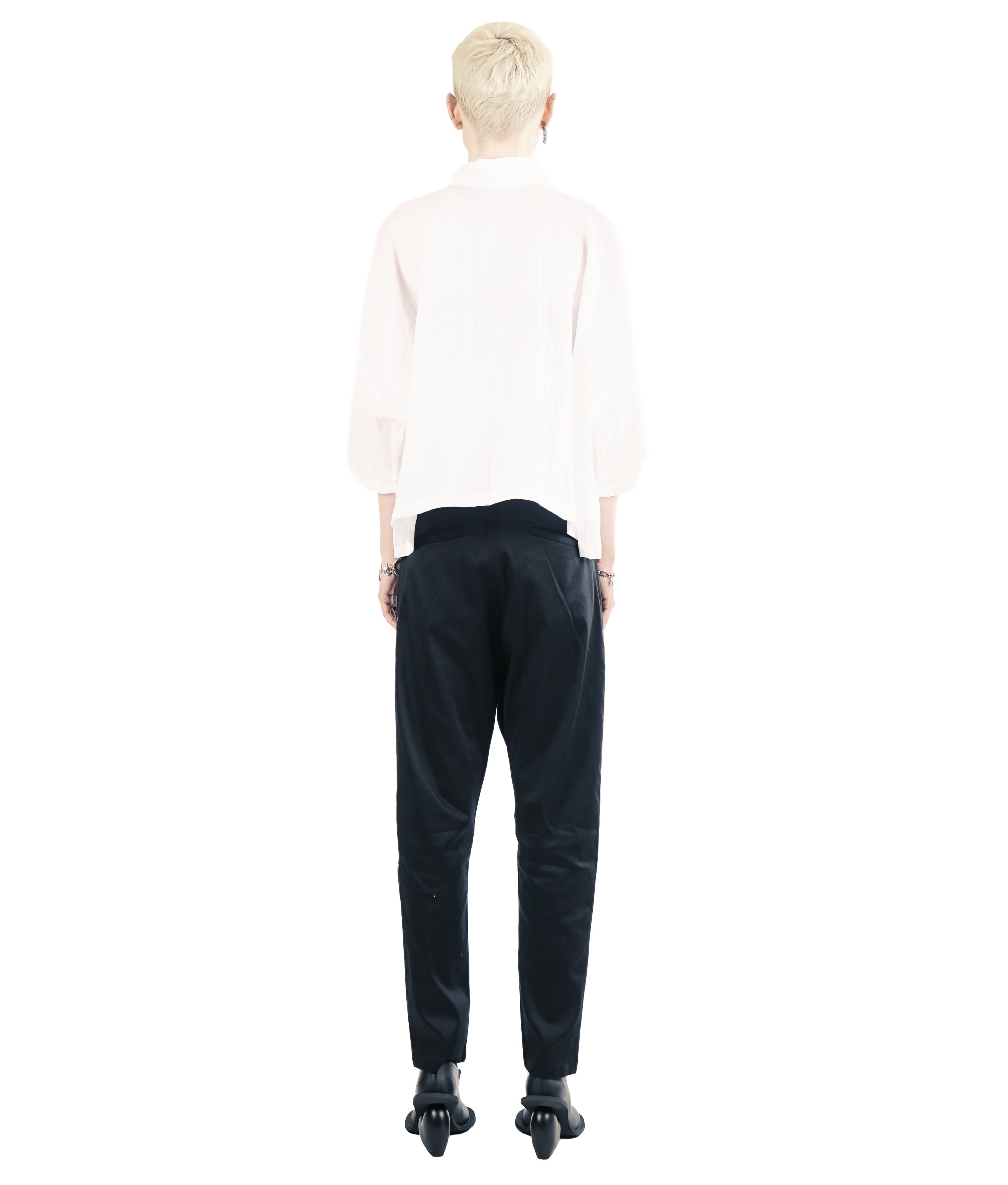 Back view of loose cropped blouse with wide unisex silhouette