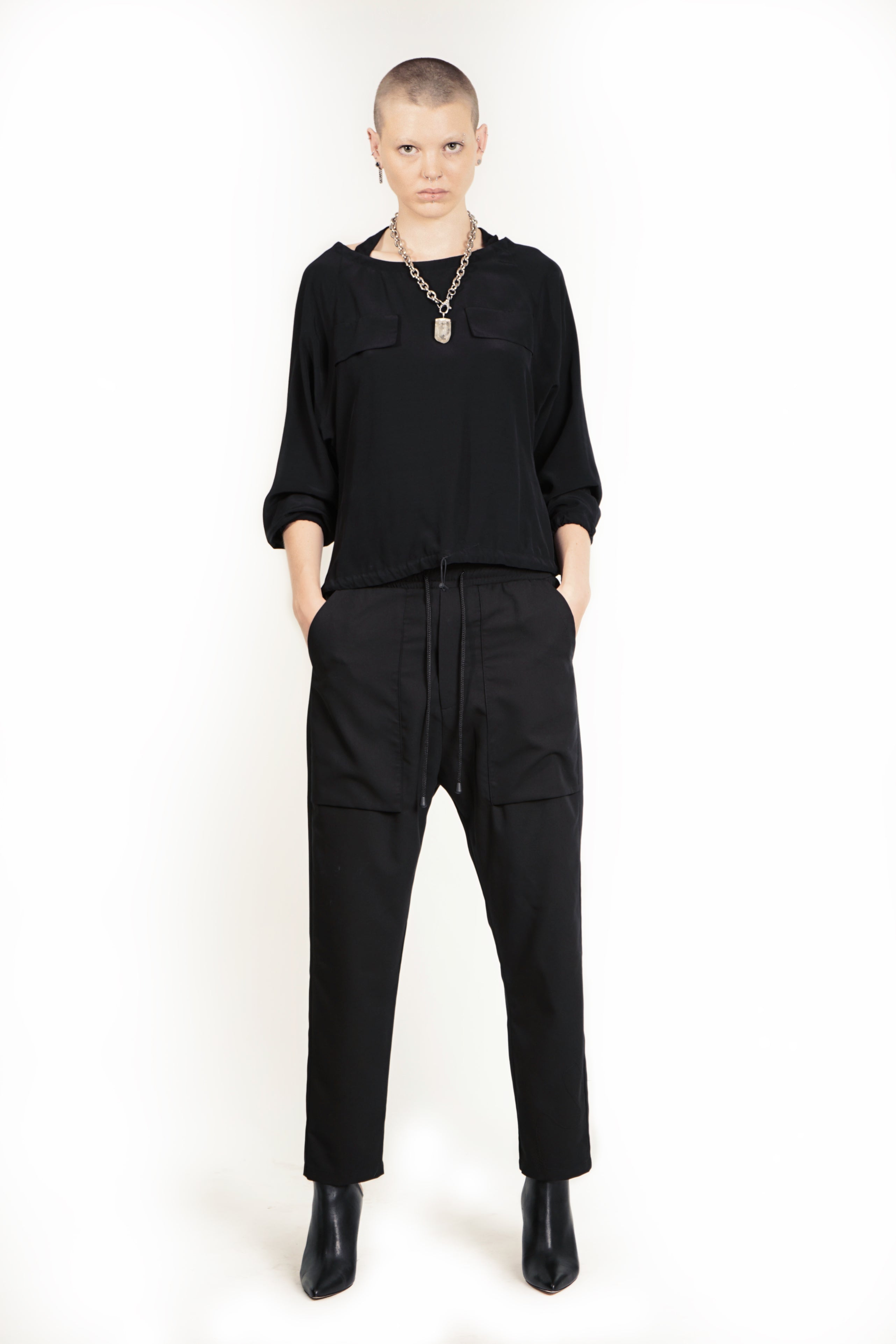 Front view of relaxed cargo trousers with tapered leg