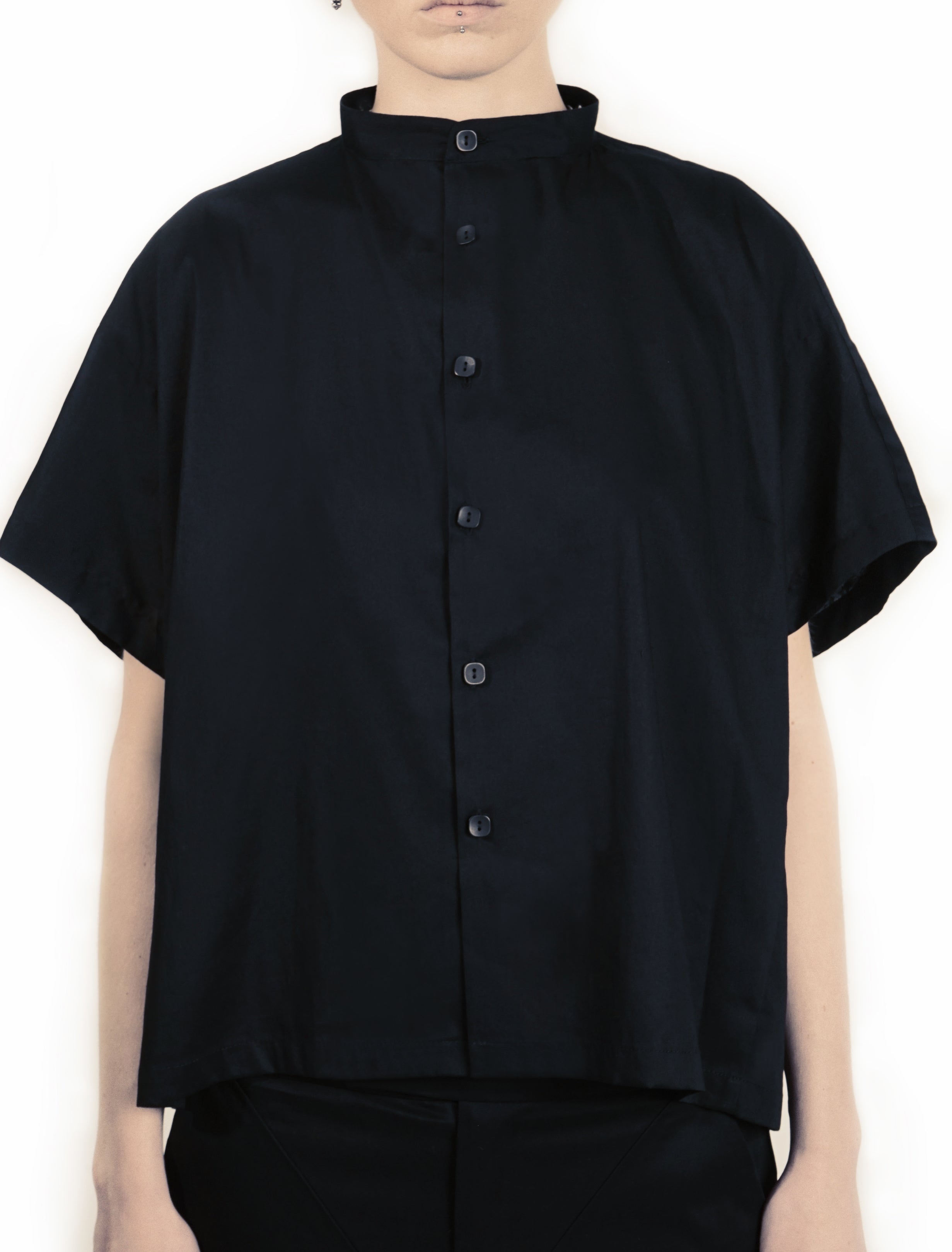 Front view of oversized white blouse with stand collar ND BUTTONS 