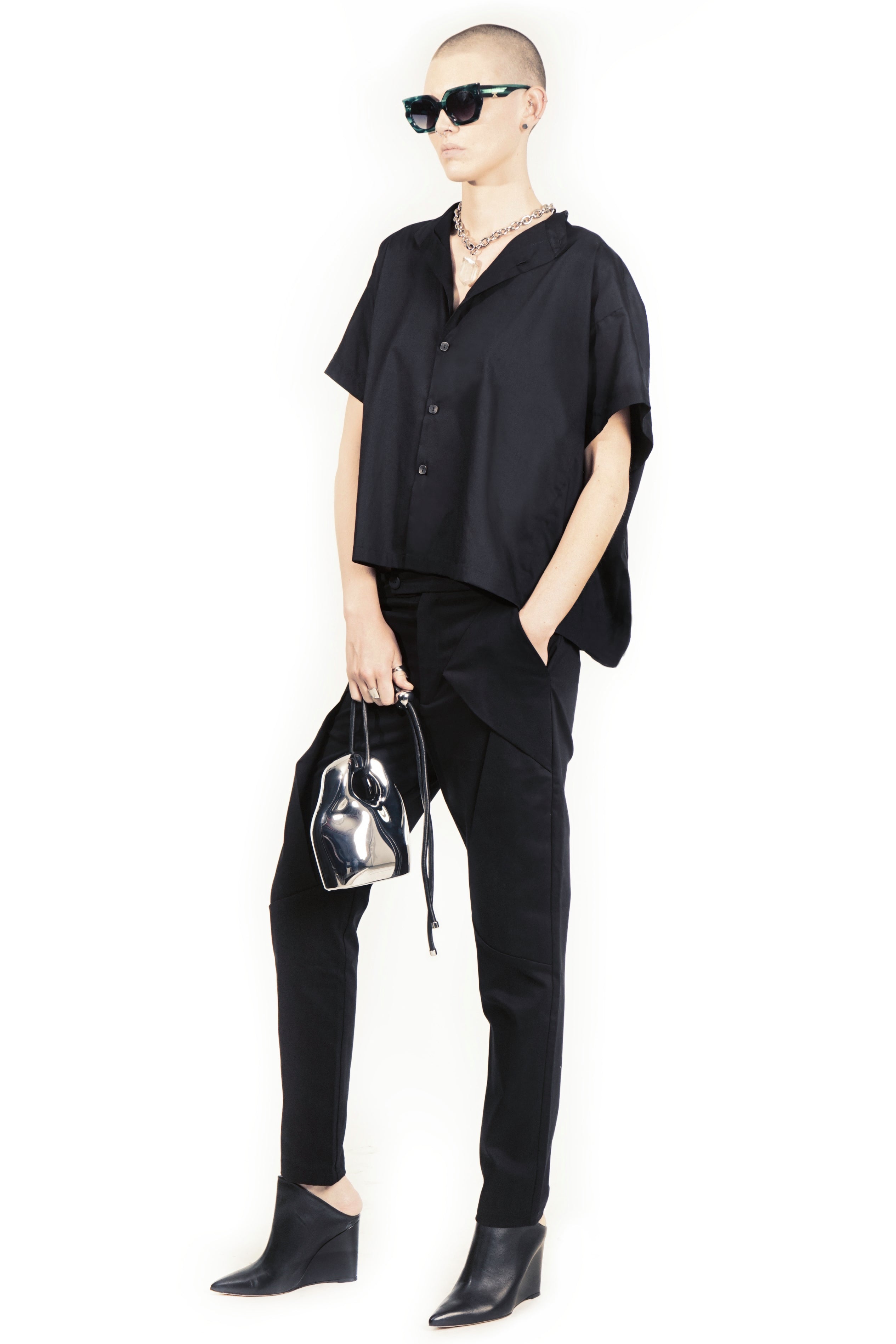 Front view of oversized white blouse with concealed closure