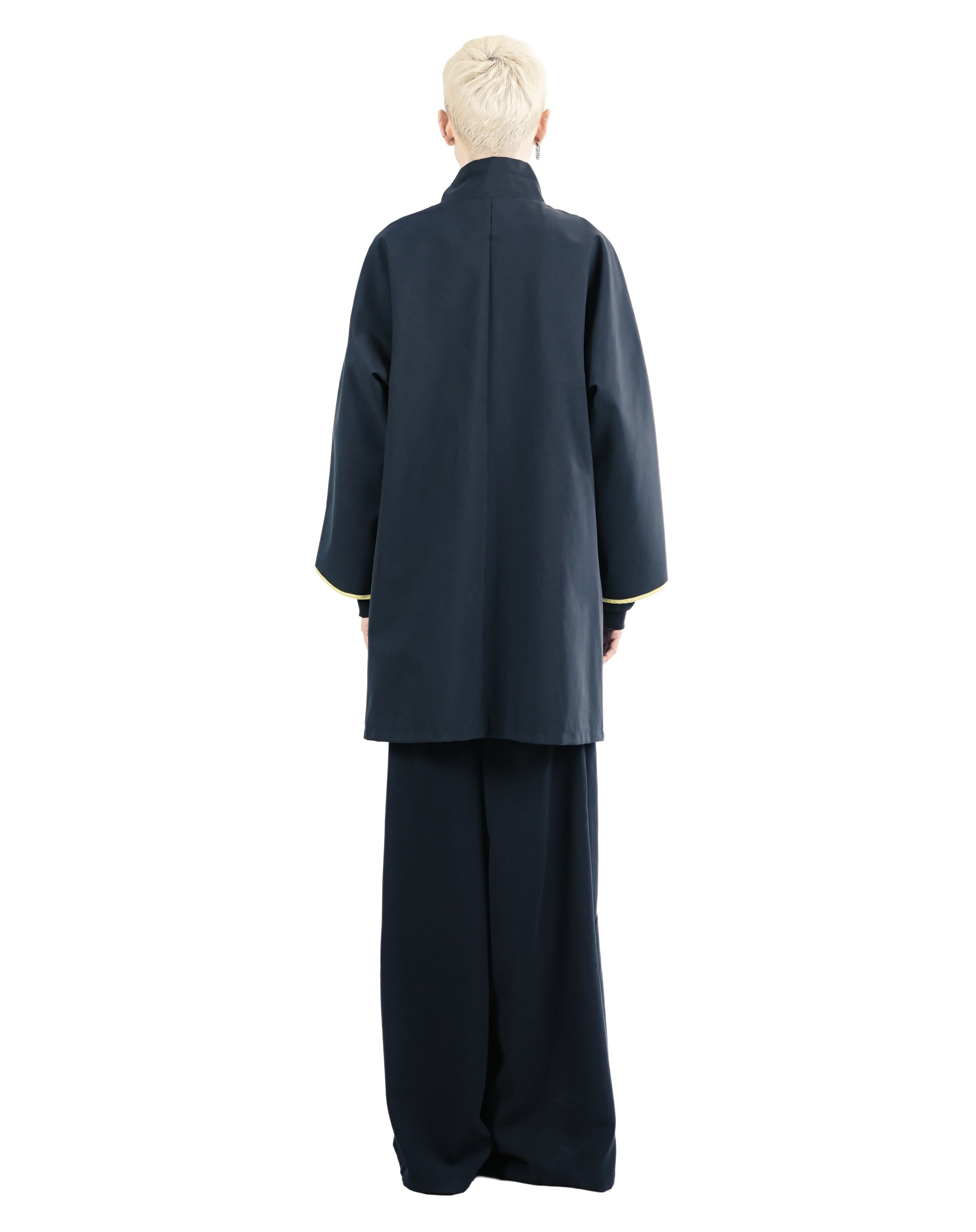 Back view of lightweight technical navy coat