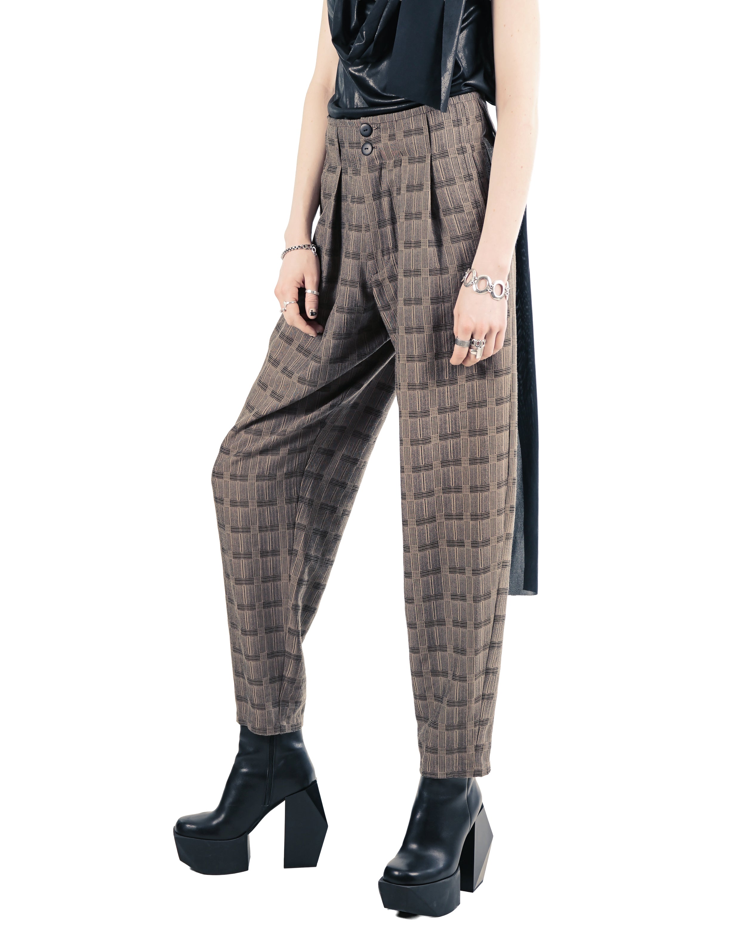 Close-up of smooth matte black trousers with integrated pockets