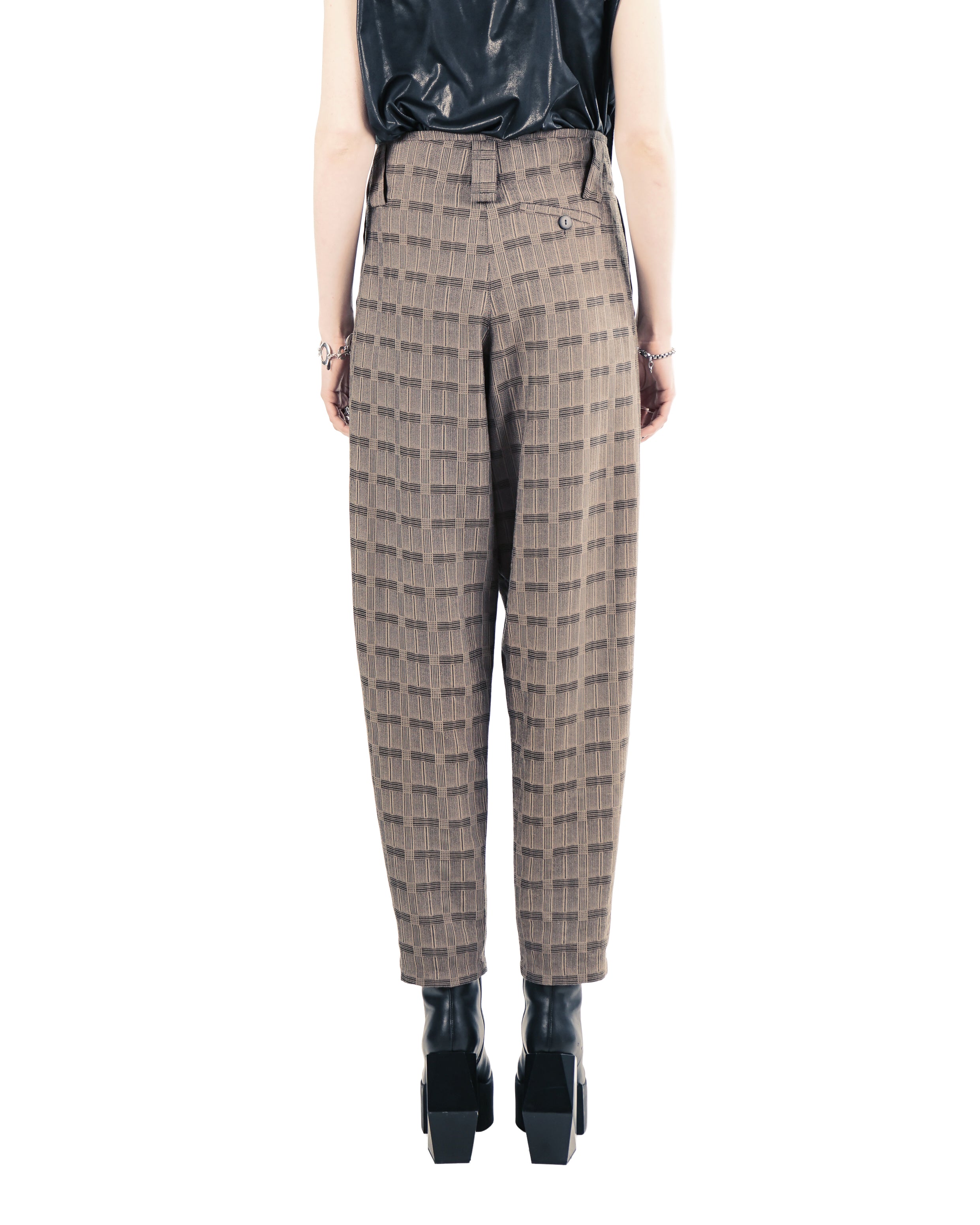 Close-up of smooth trousers with integrated pockets