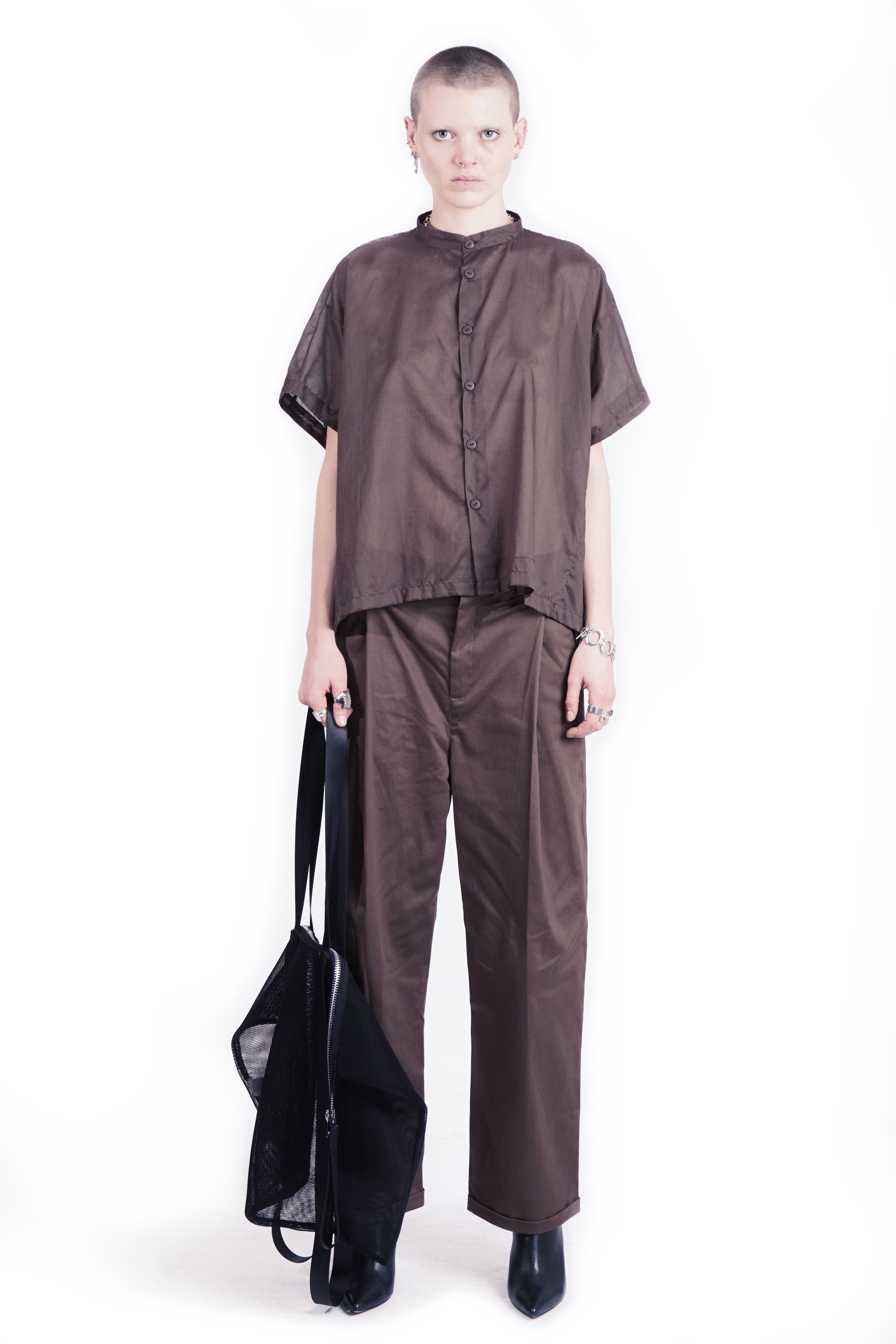 Front view of oversized tabacco brwon  blouse with stand collar