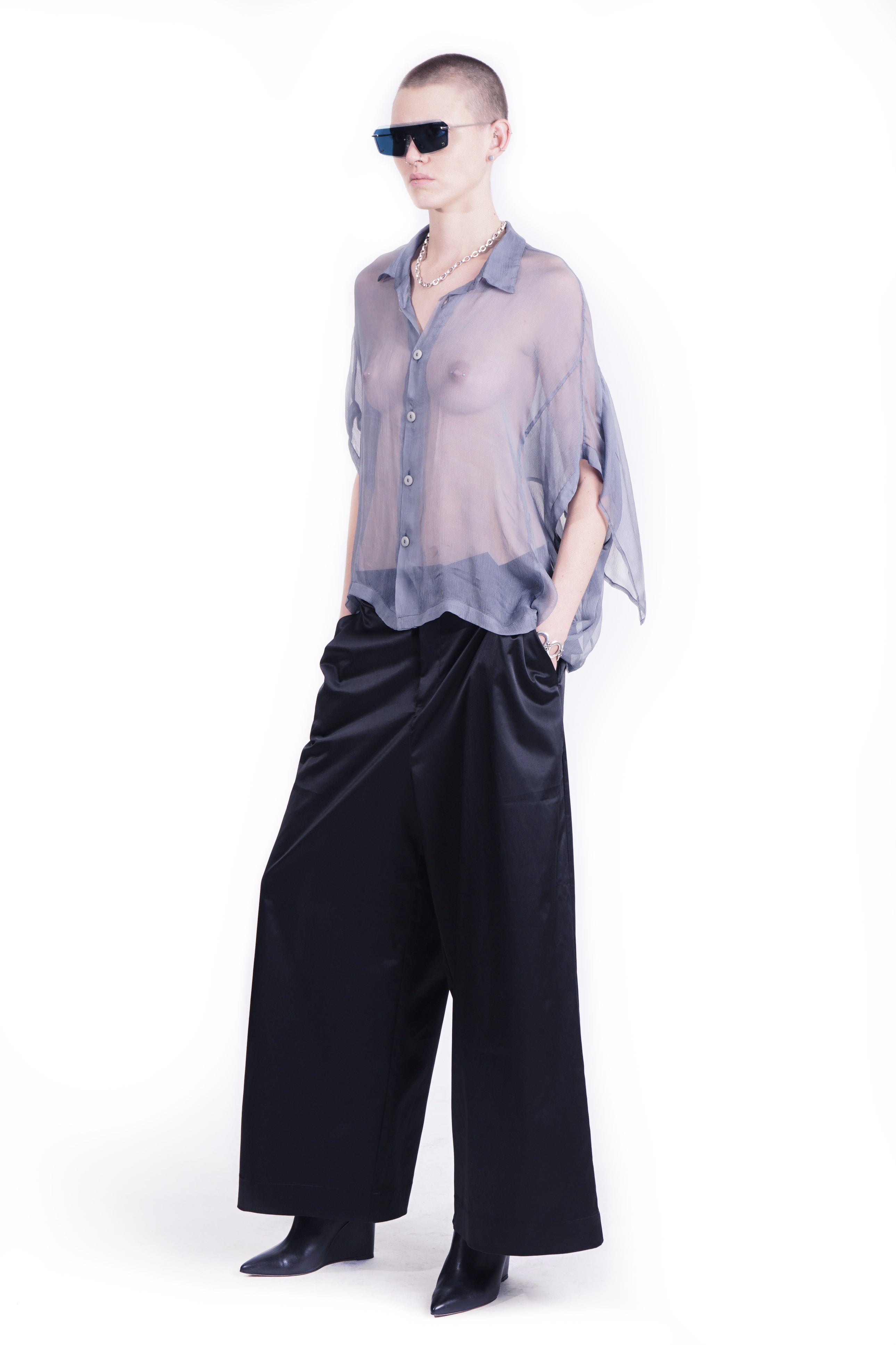 Side view of oversized blue silk  blouse with mandarin collar and back layer 