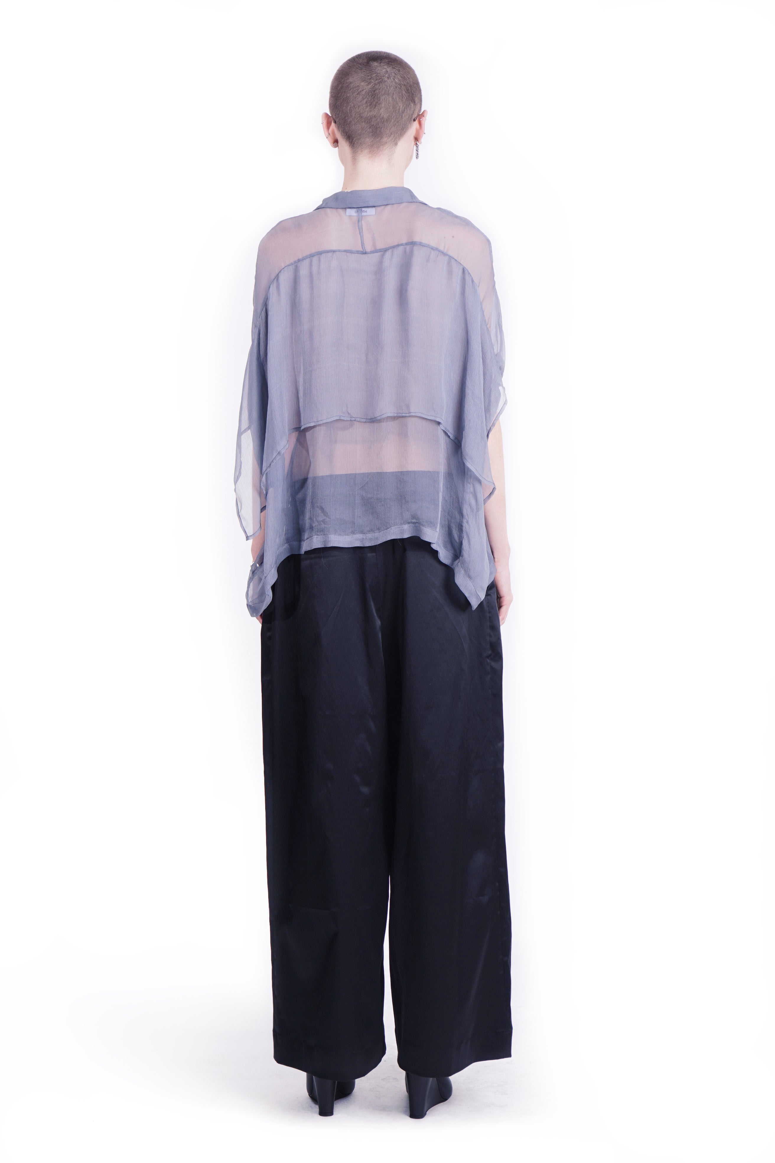 Back  view of oversized blue silk  blouse with mandarin collar and back layer 