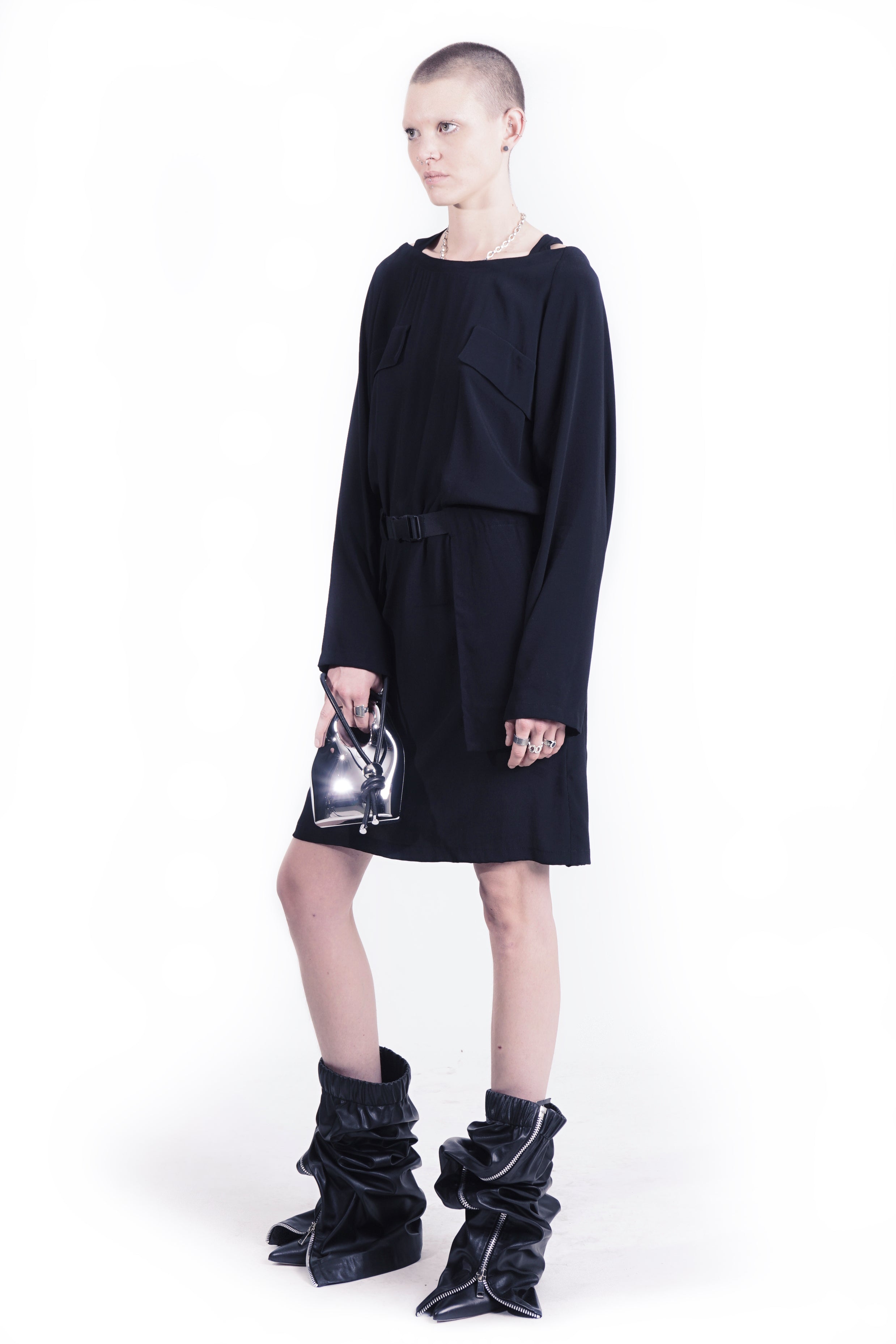 Fluid black dress with layered pockets