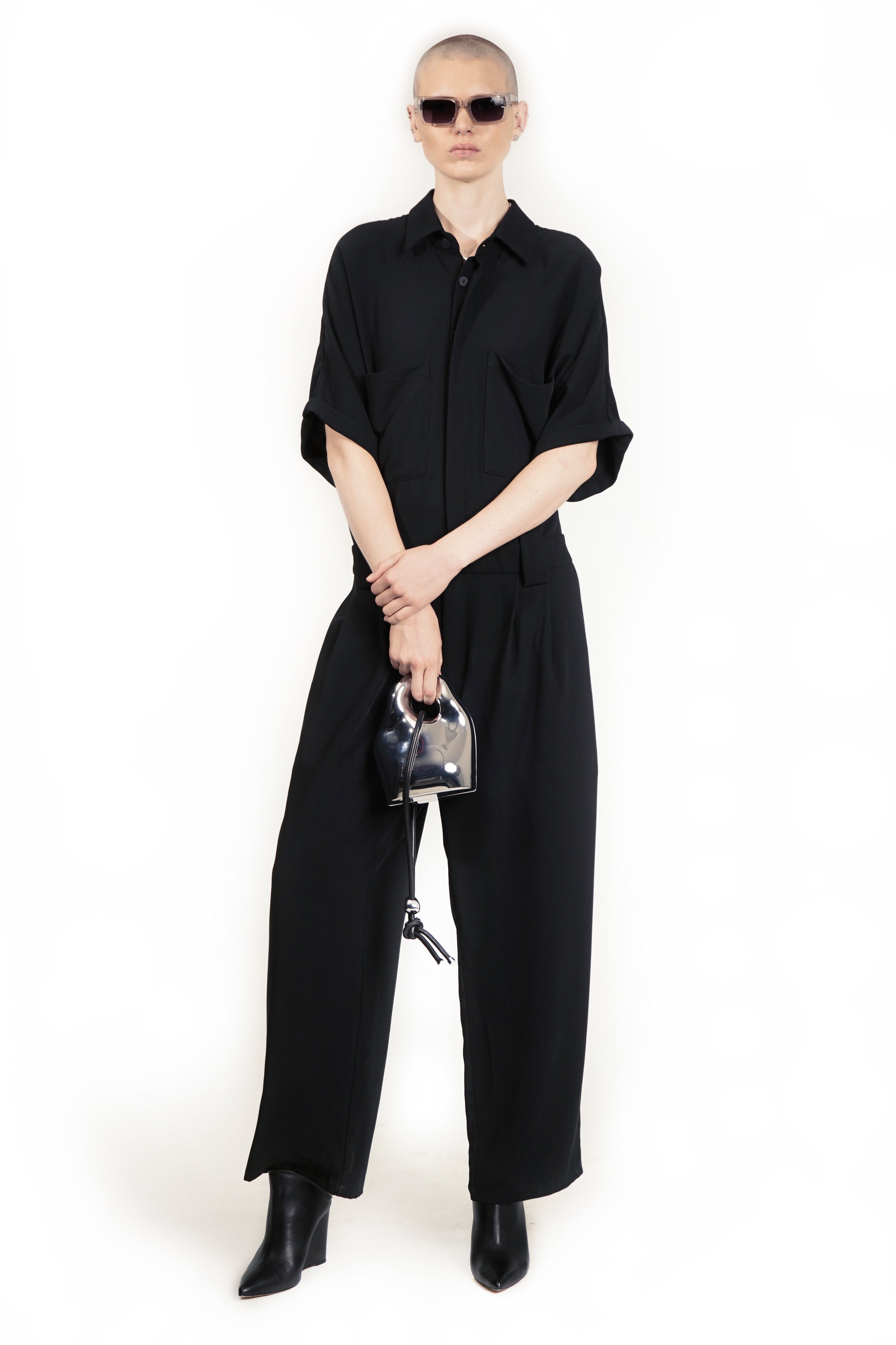 Front view of tailored jumpsuit with dropped shoulders