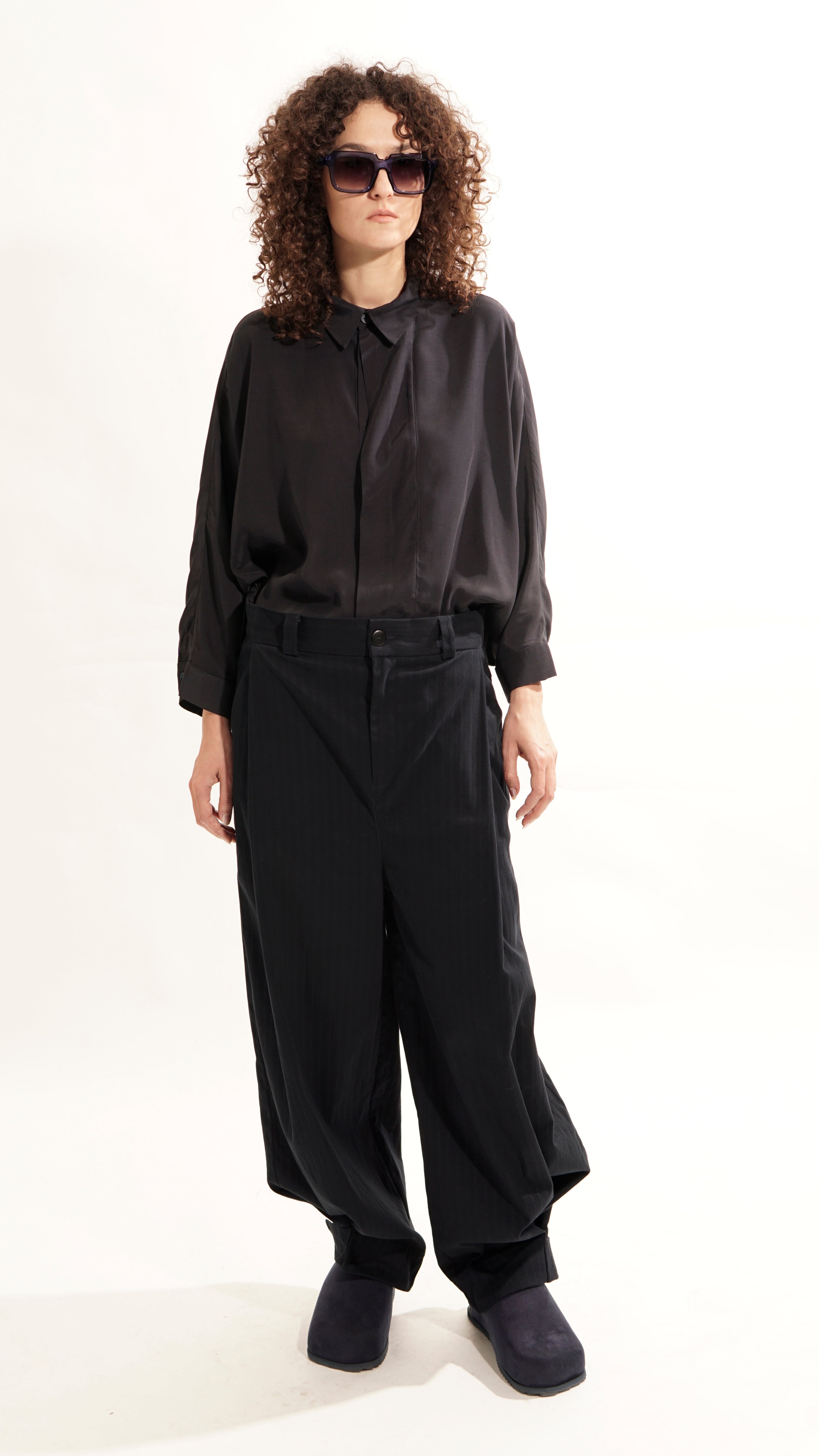 Front view of oversized blouse with concealed closure and kent collar
