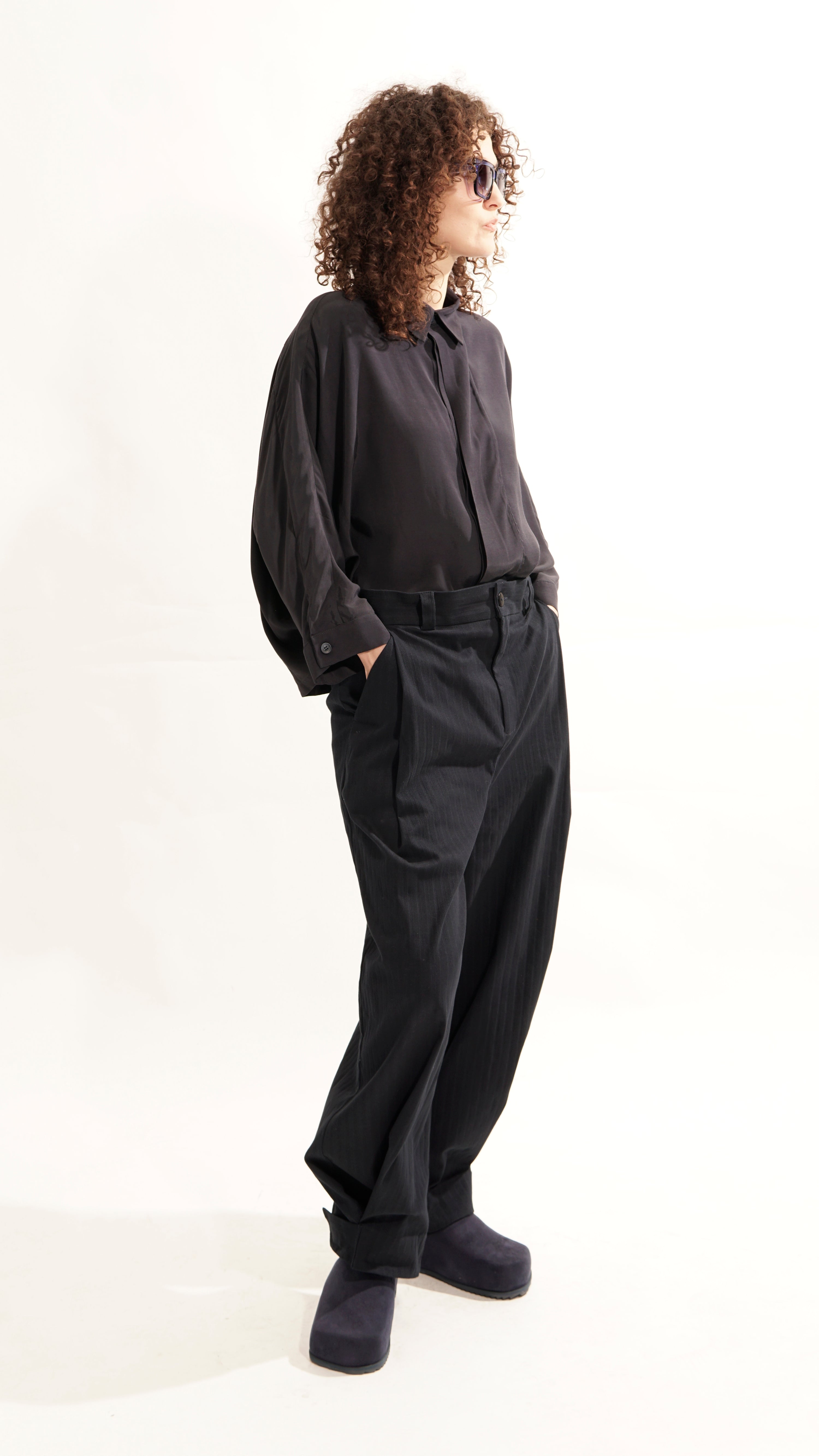Front view of oversized blouse with concealed closure and kent collar