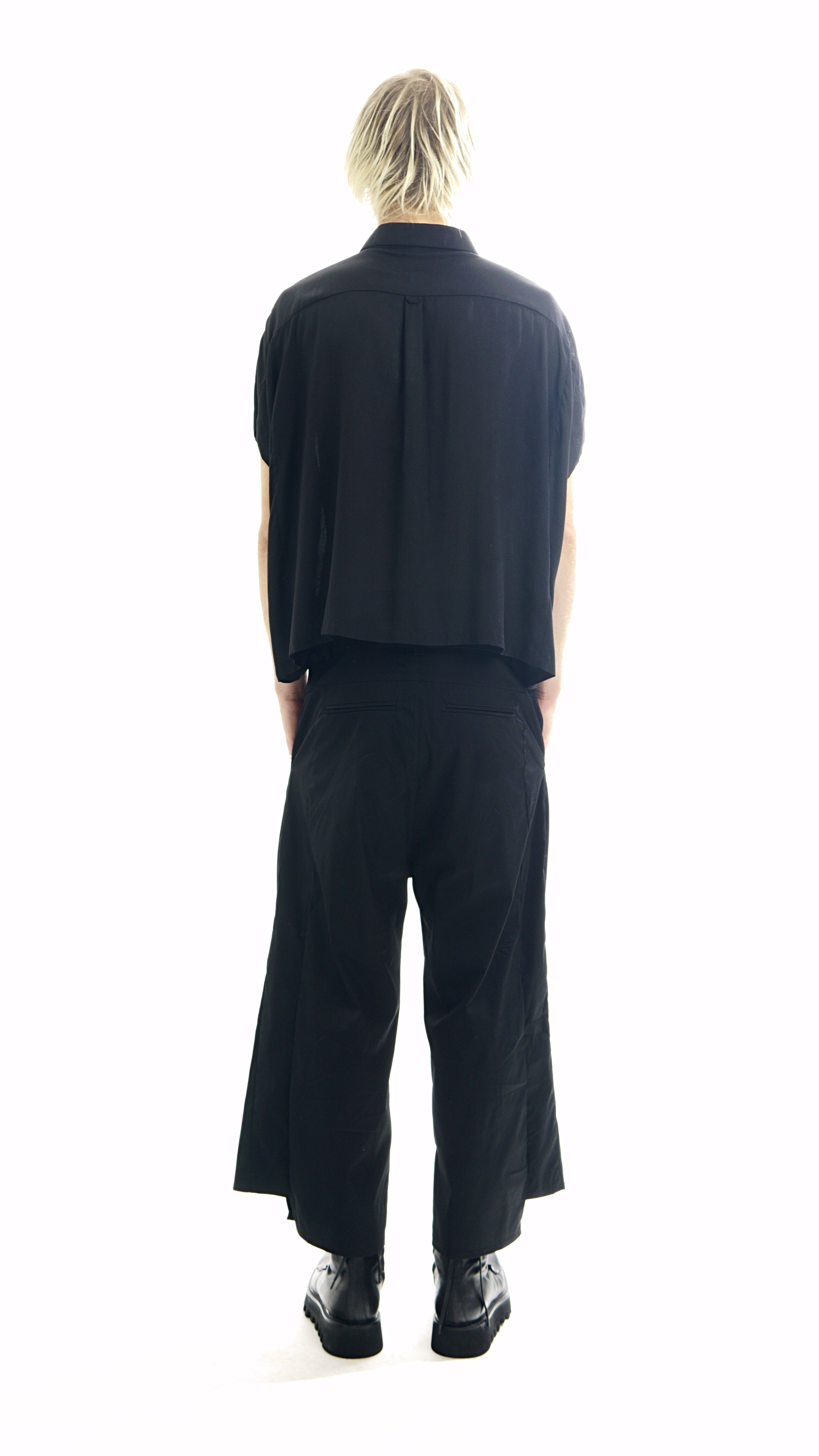 
Back view of oversized blouse with curved hem