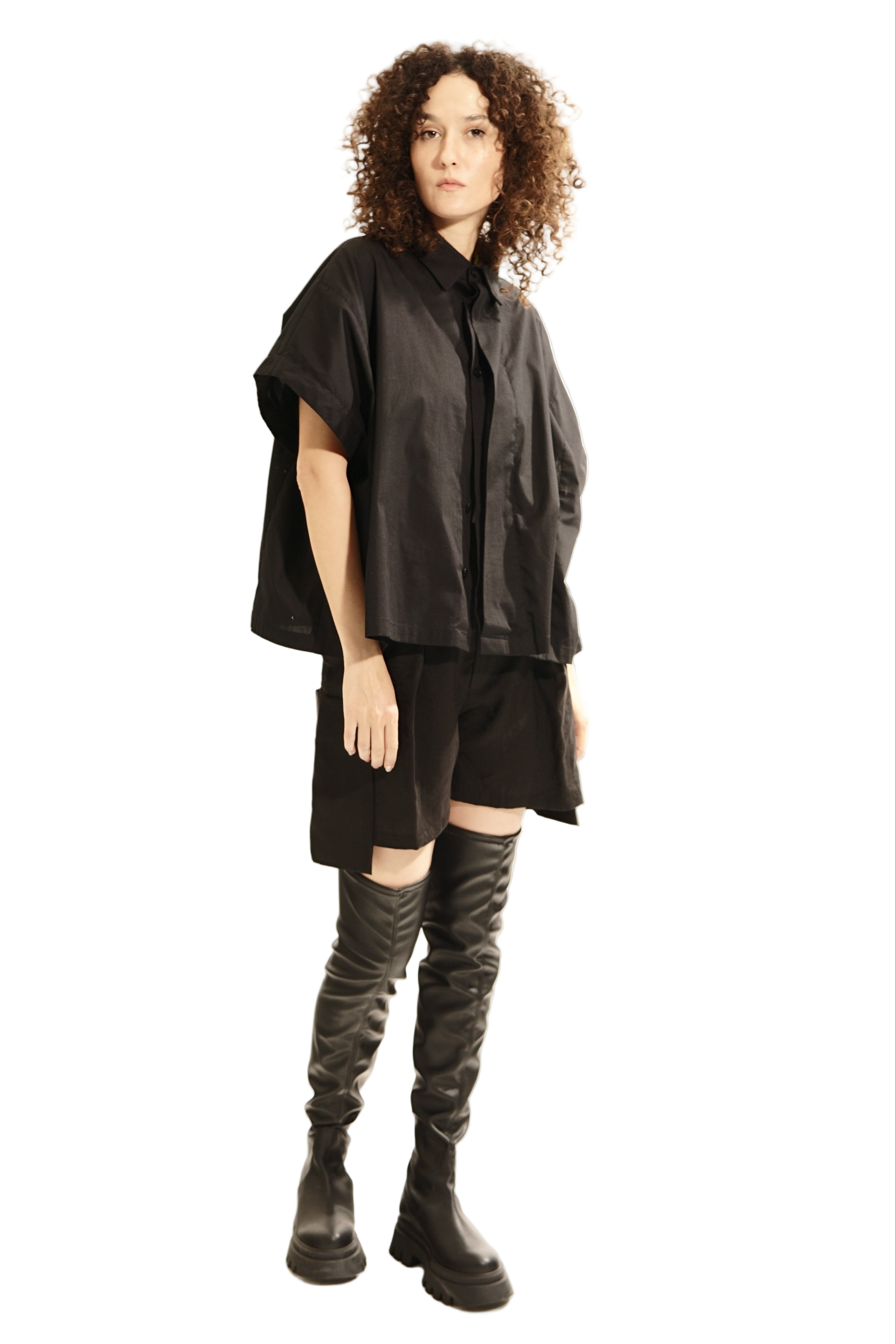 Front view of oversized black wide blouse with mandarin collar and concealed Buttons 