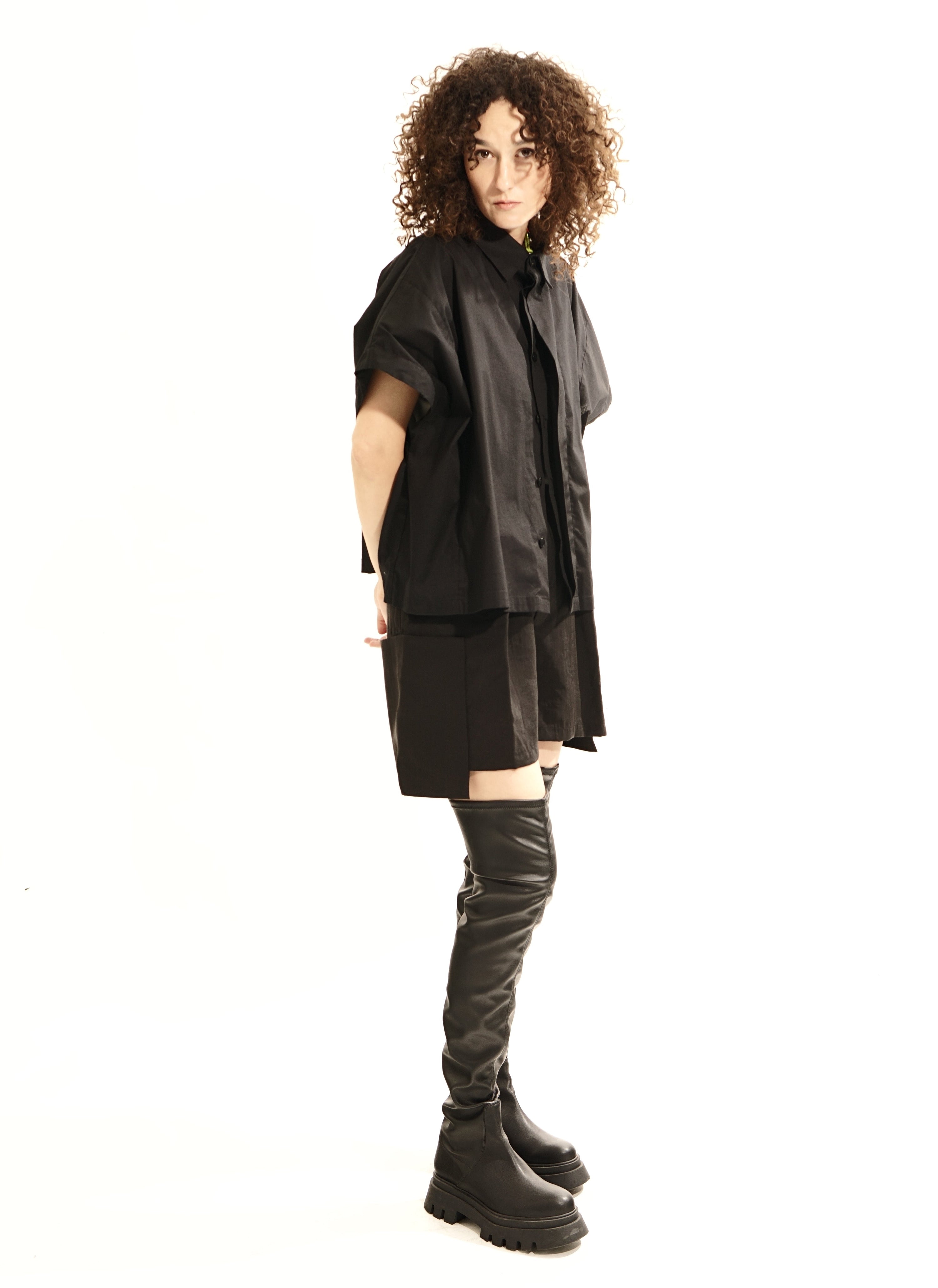 Side view of oversized black wide blouse with mandarin collar and concealed Buttons 